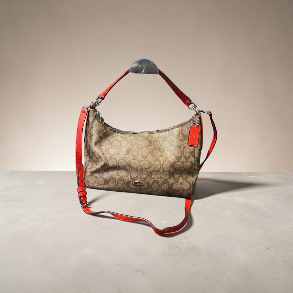 The Coach F34899 Celeste Convertible Hobo in Signature canvas With Orange Leathe